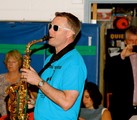 Principal playing the saxophone